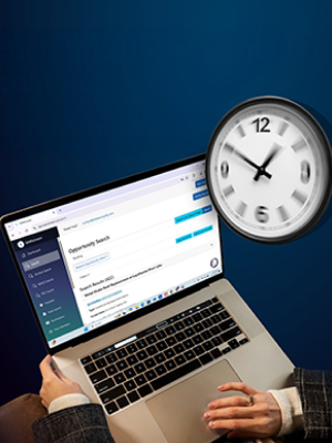 SAMstream opportunity search on a laptop beside a clock — find government contracts in minutes, not hours